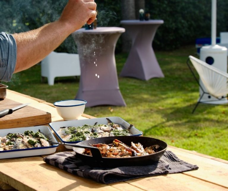 Food laid out on an outdoor table at a garden party